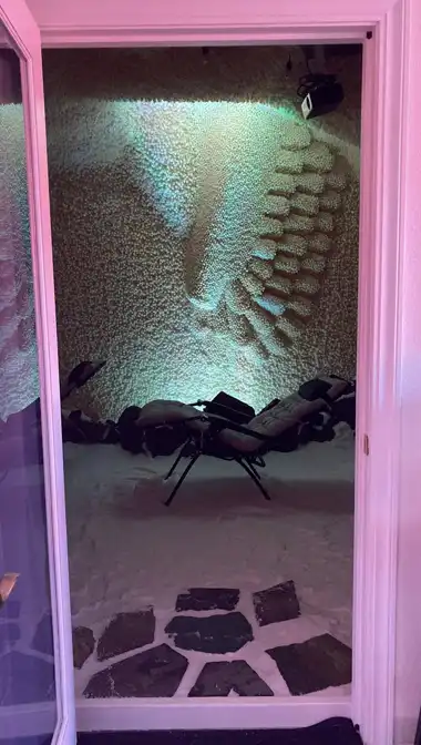 A softly lit quiet reflective space to rest and reset.