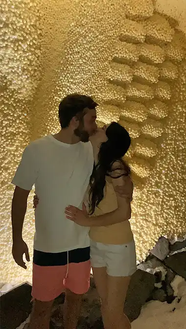 Happy Anniversary Kiss captured under 7' Cherub Wing.